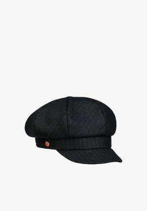 Black wool flat cap with a short curved brim and a small round red and gold emblem on the side.