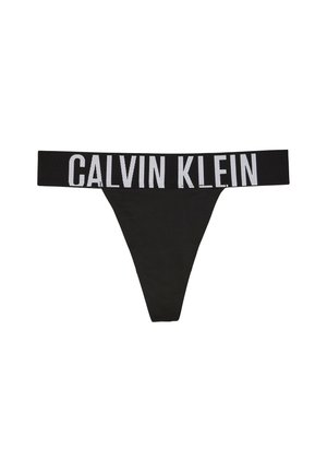 String noir Calvin Klein avec large ceinture élastique présentant le logo Calvin Klein en grandes lettres blanches.