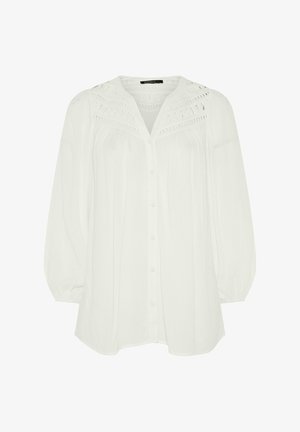 Hvid langærmet bluse med knapper foran, udskæring med blonde detaljer på bærestykket, løs pasform og elastiske manchetter.