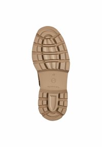 Suela de goma color marrón con un diseño texturizado y estampado que presenta surcos y crestas profundas para ofrecer tracción. Tamaño marcado como 37.