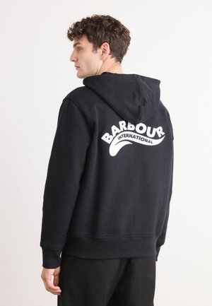 Black hoodie with a white "BARBOUR INTERNATIONAL" logo on the back. Features a relaxed fit, long sleeves, and a drawstring hood.