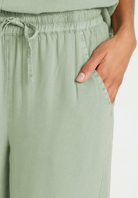 M&Co WIDE - Pantalones - light green