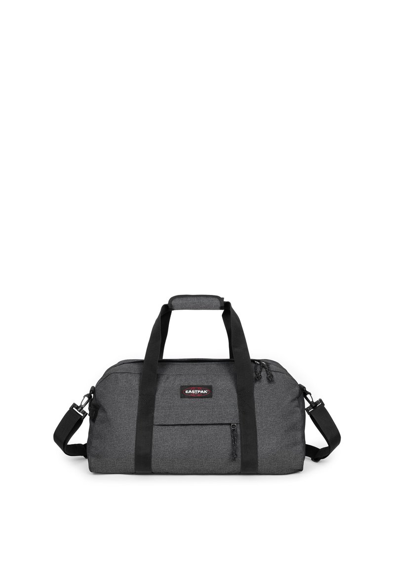 Borsa da viaggio in tessuto nero con finitura strutturata. Presenta due manici superiori, una tracolla rimovibile e una tasca frontale con cerniera.