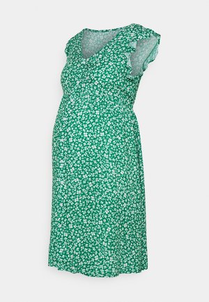 Robe de maternité verte avec motif floral blanc, manches courtes à volants, encolure en V et boutons à l'avant.