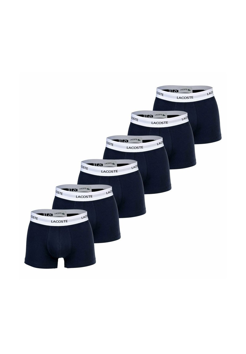 Navy boxer shorts made of cotton, featuring a white waistband with the Lacoste logo repeated. Six pairs displayed in a row.