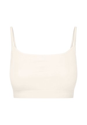 Cream-colored ribbed bralette with thin straps and a seamless design. Minimalist style with an elastic band at the bottom, featuring branding.