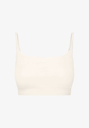 Kremowy, prążkowany biustonosz braletka z cienkimi ramiączkami i bezszwowym designem. Minimalistyczny styl z elastycznym paskiem u dołu, z logo marki.