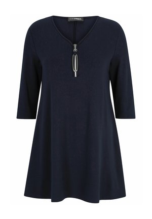 Navyblaue Tunika mit 3/4-Ärmeln, mit V-Ausschnitt und einem Reißverschlussdetail an der Vorderseite. Hergestellt aus weichem, strukturiertem Stoff.