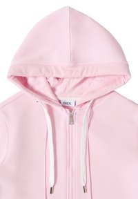 Sweat à capuche zippé rose clair avec cordons blancs et bord côtelé sur la capuche, étiqueté "CECIL" à l'intérieur du col.