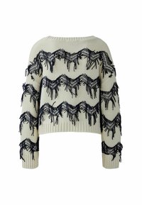 Cremfarbener Pullover mit navyblauen Fransen in einem wellenförmigen Muster. Hat lange Ärmel und einen gerippten Saum. Strukturierter Strickstoff.