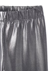 Metallic silver leggings with an elastic waistband, smooth texture, and reflective finish, featuring gathered detailing at the waist.