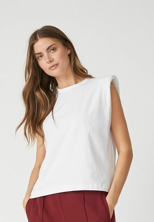 White sleeveless t-shirt made from soft cotton, featuring a round neckline and dropped shoulder design, with a relaxed fit and smooth texture.