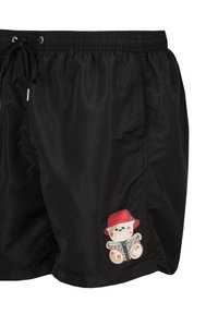 Zwarte zwemshorts met een elastische tailleband en trekkoord, voorzien van een kleurrijke berenafbeelding met een rode hoed aan de onderkant.