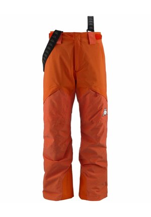 Pantaloni da sci arancioni con tessuto a contrasto testurizzato nella parte bassa delle gambe. Presentano bretelle nere regolabili e un logo sul lato sinistro anteriore.