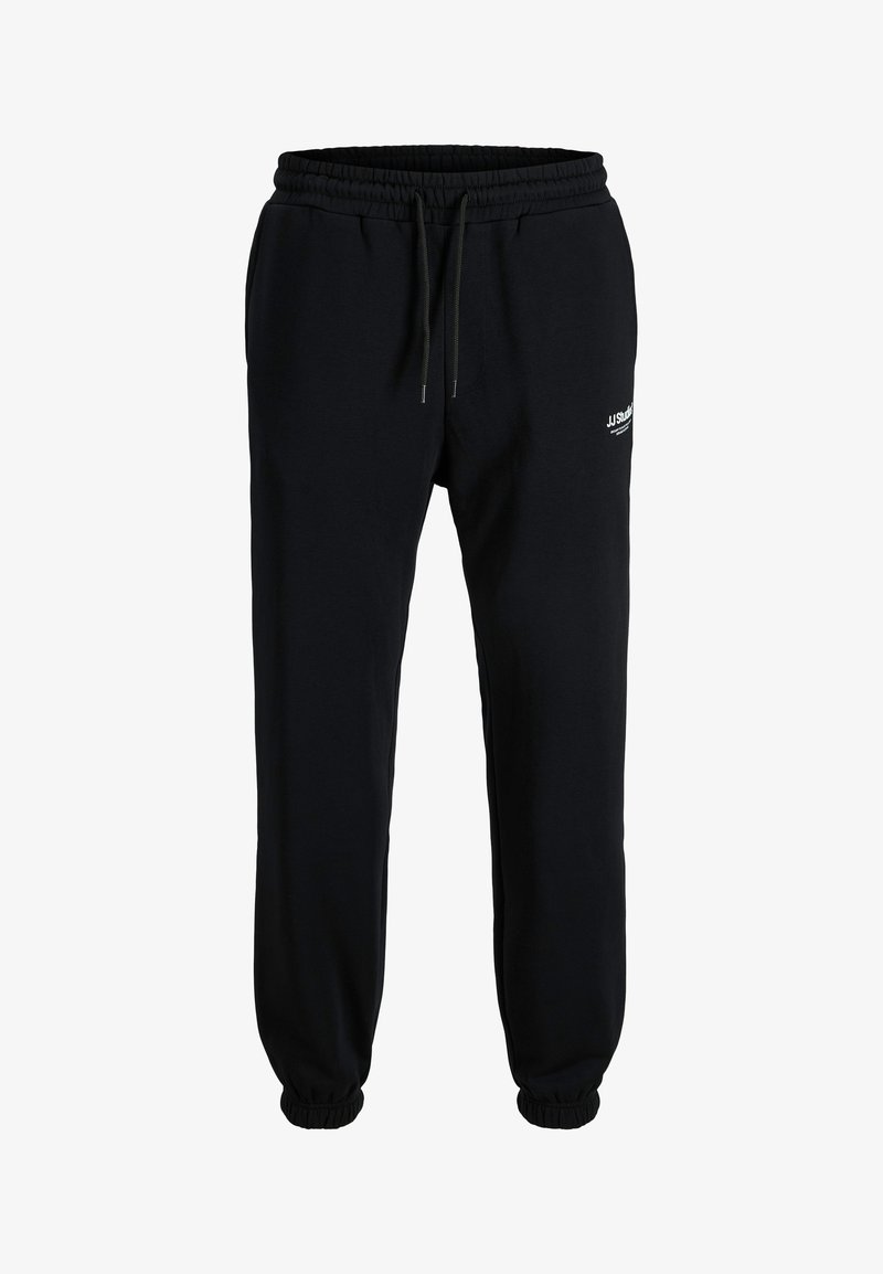 Pantalons de jogging noirs en tissu coton stretch doux, avec une taille élastique, cordon de serrage et poignets côtelés. Détail de logo discret.