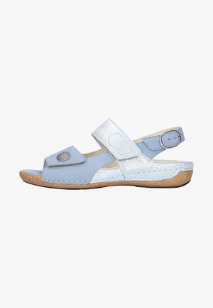 Light blue women's sandal with two adjustable straps, silver buckle, decorative oval button, and cork sole with slight heel.