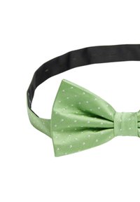 Grön sidenfluga med vita prickar och en strukturerad yta, med ett justerbart svart band.