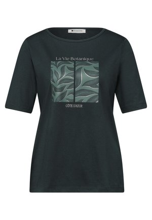 Sort kortærmet skjorte med et grønt botanisk bladdesign opdelt af en sort linje og teksten "La Vie Botanique" og "Côte d'Azur" foran.