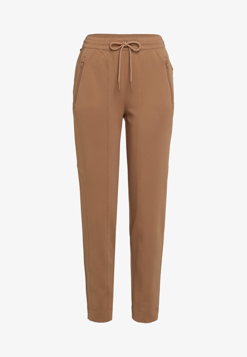 Brown tapered pants with drawstring waist and zippered side pockets, tailored seams, and ankle-length hem.