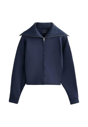 Marineblauwe sweatvest met ritssluiting, brede geribbelde kraag, lange mouwen en geribbelde boorden, weergegeven tegen een witte achtergrond.