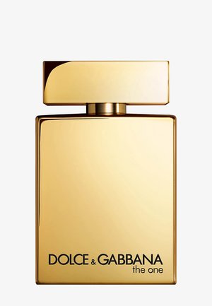 Flacon de parfum rectangulaire doré avec un bouchon assorti, étiqueté « "Dolce & Gabbana the one" » en texte noir en bas.