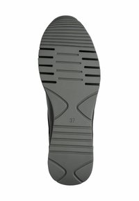 Semelle de chaussure en caoutchouc gris, présentant des rainures horizontales et une forme arrondie, marquée de la taille « 37 » à un emplacement bien visible.