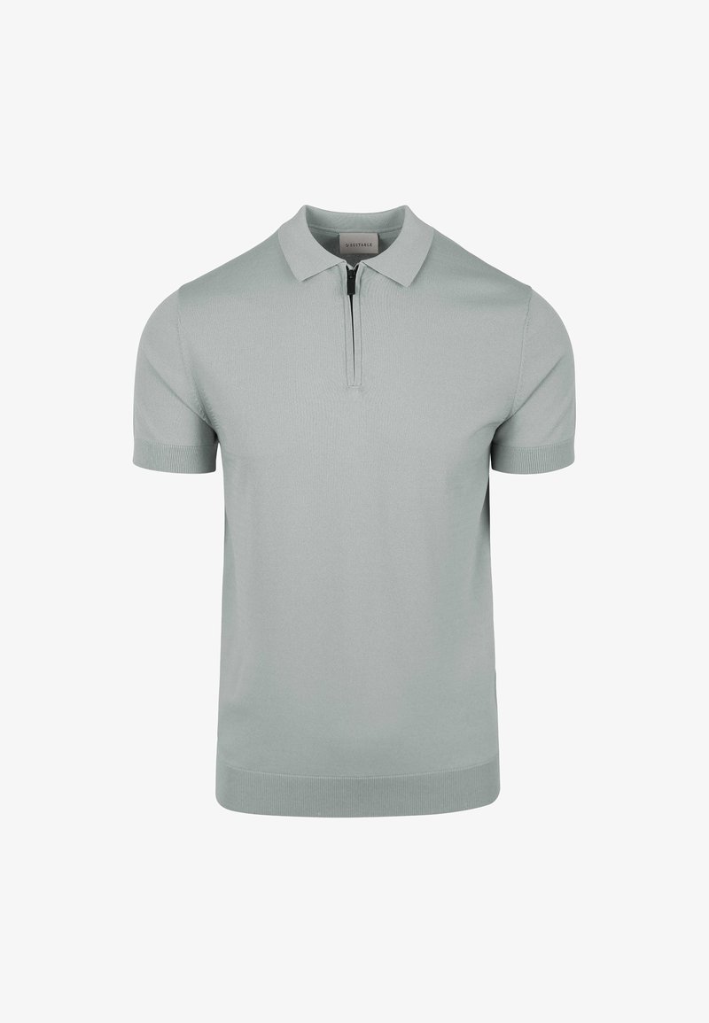 Hellgrünes Poloshirt mit kurzen Ärmeln aus glattem Strickstoff, mit einem Reißverschlusskragen und gerippten Bündchen. Einfaches, modernes Design.