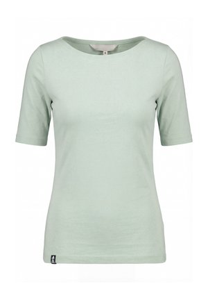 Lichtgroen strakvallend T-shirt met korte mouwen, ronde hals en een klein zwart labeltje vlak bij de onderzoom.