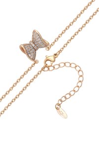 Rosaguld kæd Necklace med en sløjfeformet vedhæng beklædt med klare krystaller. Inkluderer en hummerlås og justerbar kædelængde.