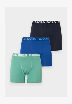 Trzy bokserki Björn Borg w kolorach zielonym, niebieskim i czarnym z logo na paskach w talii, ułożone na białym tle.