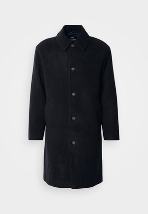 Casaco de lã preto com gola, fecho de botão, bolsos laterais e corte reto. Textura suave com um design minimalista.