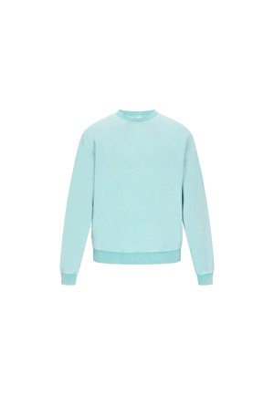 Svetlo modra dukserica iz mehkega materiala, z okroglim izrezom, dolgimi rokavi in rebrastimi manšetami ter robom. Brez vidnih vzorcev ali logotipov.