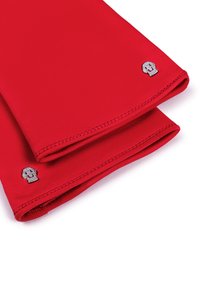 Red leather gloves folded, each featuring a small silver skull emblem near the wrist edge on a white background.