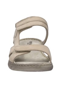 Beżowe sandały z rzepami, z odkrytymi palcami oraz wyściełaną wkładką. Posiadają przeszywane akcenty i teksturowaną podeszwę dla lepszej przyczepności.