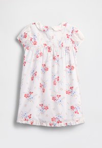Vestido branco com padrão floral azul e vermelho, mangas curtas bufantes, gola redonda e bainha com folhos. Apresenta pregas verticais e botões.