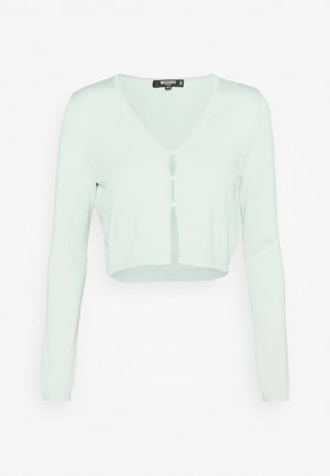 Cardigan court vert menthe clair avec manches longues, col en V et trois boutons blancs sur le devant.