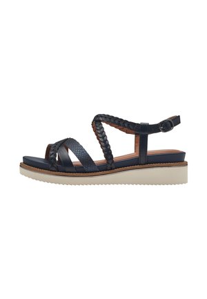 Sandales pour femmes bleu marine avec des brides tressées et des accents texturés, dotées d'une semelle plateforme avec un fond en caoutchouc beige. Bride de cheville ajustable.