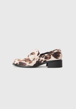 Low-heeled loafer with black stacked heel, beige and brown animal print fabric upper, and decorative strap across the vamp.