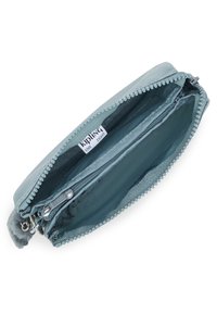 Light blue zippered wallet with a smooth exterior, a soft pom-pom accent, and multiple interior compartments for organization.