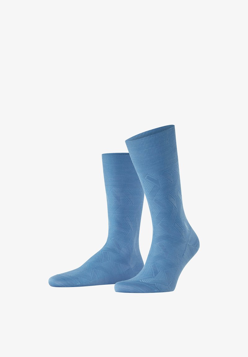 Blaue Socken aus strukturiertem Material mit einem geometrischen Muster, geripptem Bund und glatter Oberfläche, entworfen für Komfort und Stil.