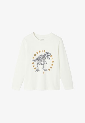 White long-sleeve shirt featuring a T-rex skeleton graphic. Text reads "Fossil Digger" in orange. Soft cotton material with a round neck.