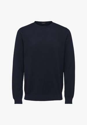 Tengerészkék, hosszú ujjú pulóver, kerek nyakkal, puha anyagból készült. Bordás mandzsettákkal és hemhel rendelkezik, ami feszesebb megjelenést biztosít.