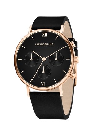 Rund sort ur med et roseguld urkasse, to undermålere, sort læderrem og romerske tal ved kl. 6 og 12.