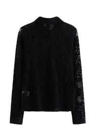 Svart spetsjacka med långa ärmar, krage och blommönster. Halvtransparent design med strukturerad tyg genom hela.