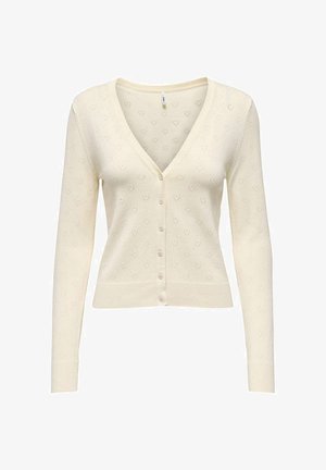 Cardigan crème à manches longues, boutonné, avec col en V et motif subtil en forme de cœur tricoté sur l'ensemble du tissu.