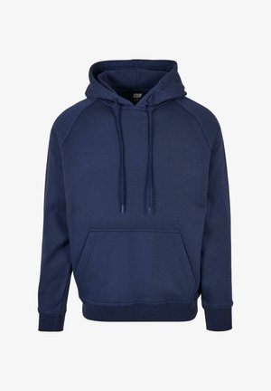 Nave plava dukserica s kenguruzim džepom, špagicama i rebrastim manžetama. Izrađena od mekanog materijala, s opuštenim krojem i raglan rukavima.