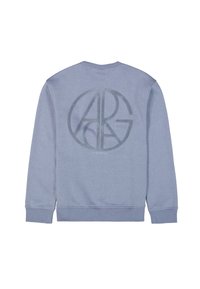 Sudadera azul claro con un gran logo circular en un tono más oscuro. Hecha de una tela suave con puños y dobladillo de canalé.