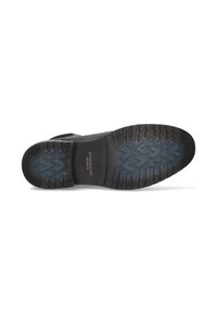 Suela de zapato negra con goma texturizada, que presenta un patrón de banda de rodadura geométrico. Logotipo y nombre de la marca destacados en dorado.