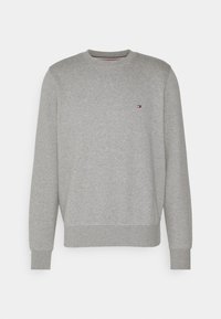 Szara bluza z okrągłym dekoltem, ściągaczami przy rękawach i u dołu oraz małym logo na piersi. Wykonana z miękkiej bawełnianej mieszanki tkanin.