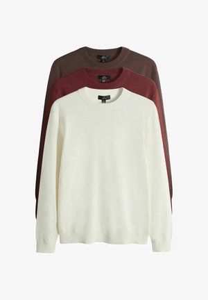 Komplekts ar trim sporta džemperiem ar apaļu kaklu — baltā, vīnsarkanā un tumši brūnā krāsā. Ir gari mēteļiem piedurknes un ribaina apdare aprocēm, izgatavoti no mīksta auduma.